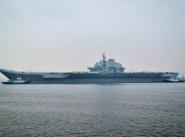 Авианосец «Ляонин» впервые прибывает в новый военный порт Циндао